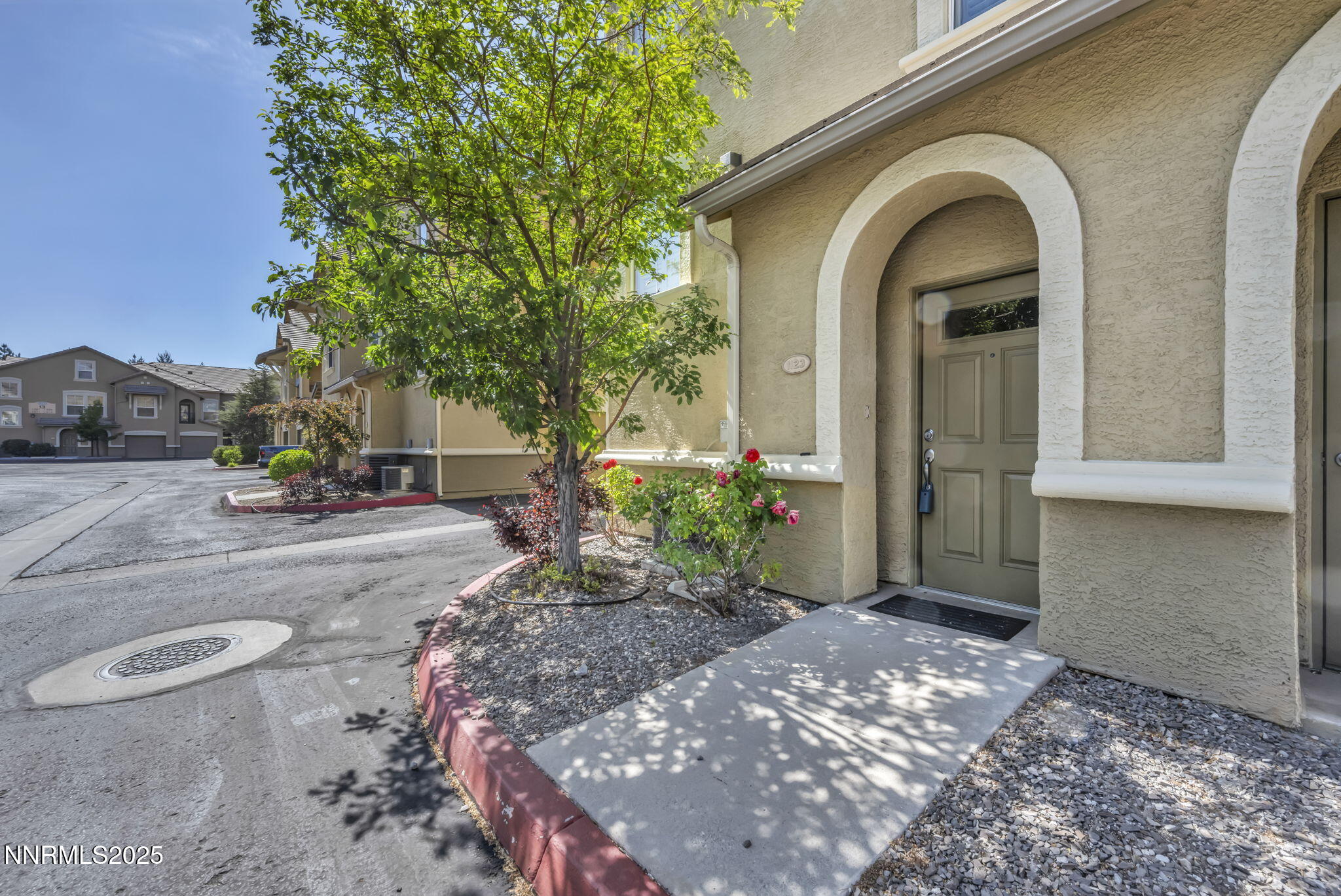 9050 Double R Boulevard, Unit 1123 Reno, NV 89521 - Photo 4 of 39 a view of a garden with pathway