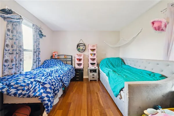 a bedroom with bed and balcony