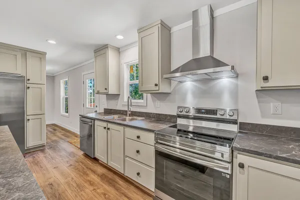 a kitchen with a stove and a sink