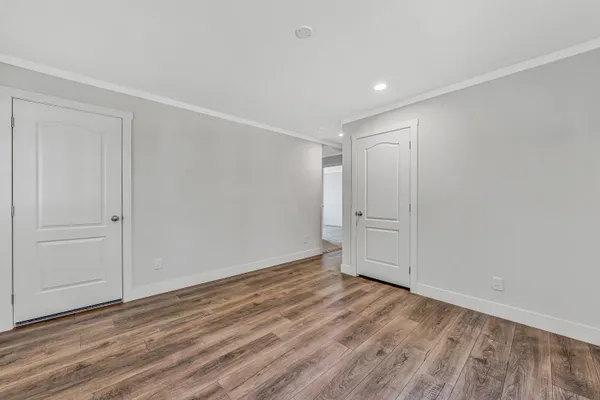 a balcony with wooden floor and fence