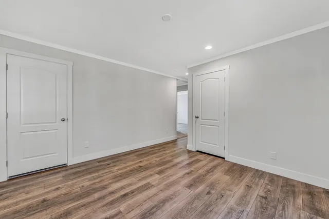 a balcony with wooden floor and fence