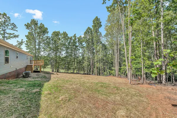 a view of backyard with green space