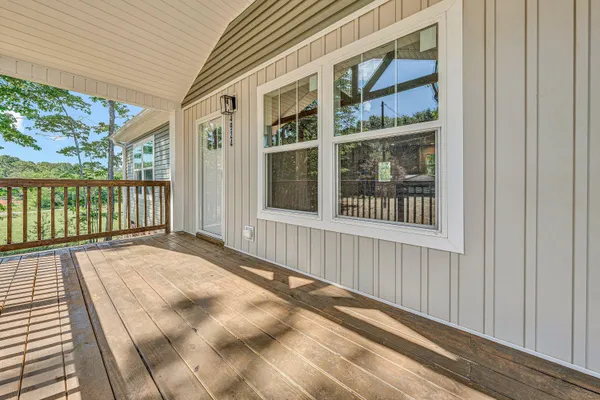 a view of a brick house with large windows