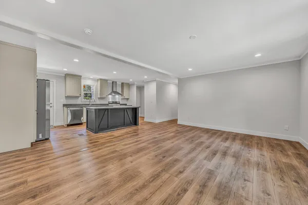 a view of kitchen with wooden floor and a kitchen