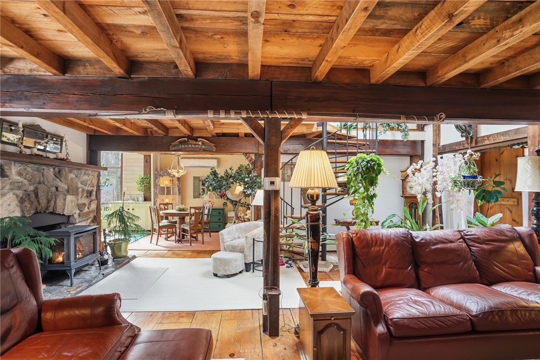 186 Arcadia Road Hopkinton, RI 02832 - Photo 5 of 27 Living room which additionally leads out to back deck overlooking river.