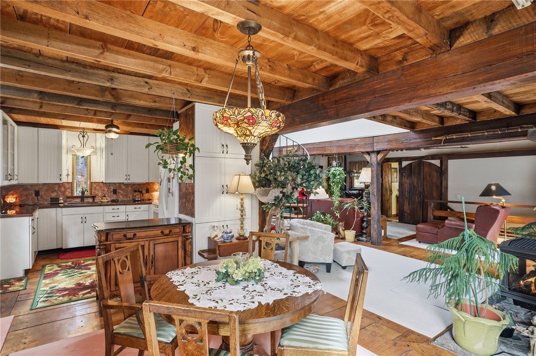 186 Arcadia Road Hopkinton, RI 02832 - Photo 8 of 27 Dining area and open kitchen that additionally extends to large beautiful sunroom