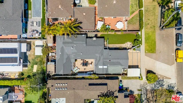 an aerial view of houses with outdoor space