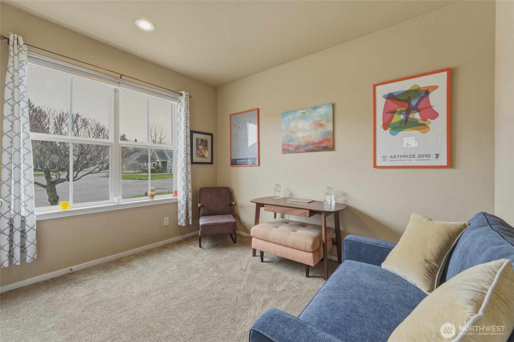 764 Southeast Quail Run College Place, WA 99324 - Photo 13 of 40 a living room with furniture and a large window