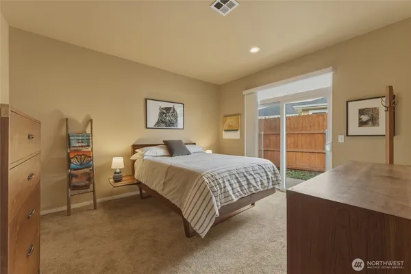 a bedroom with a bed and a desk