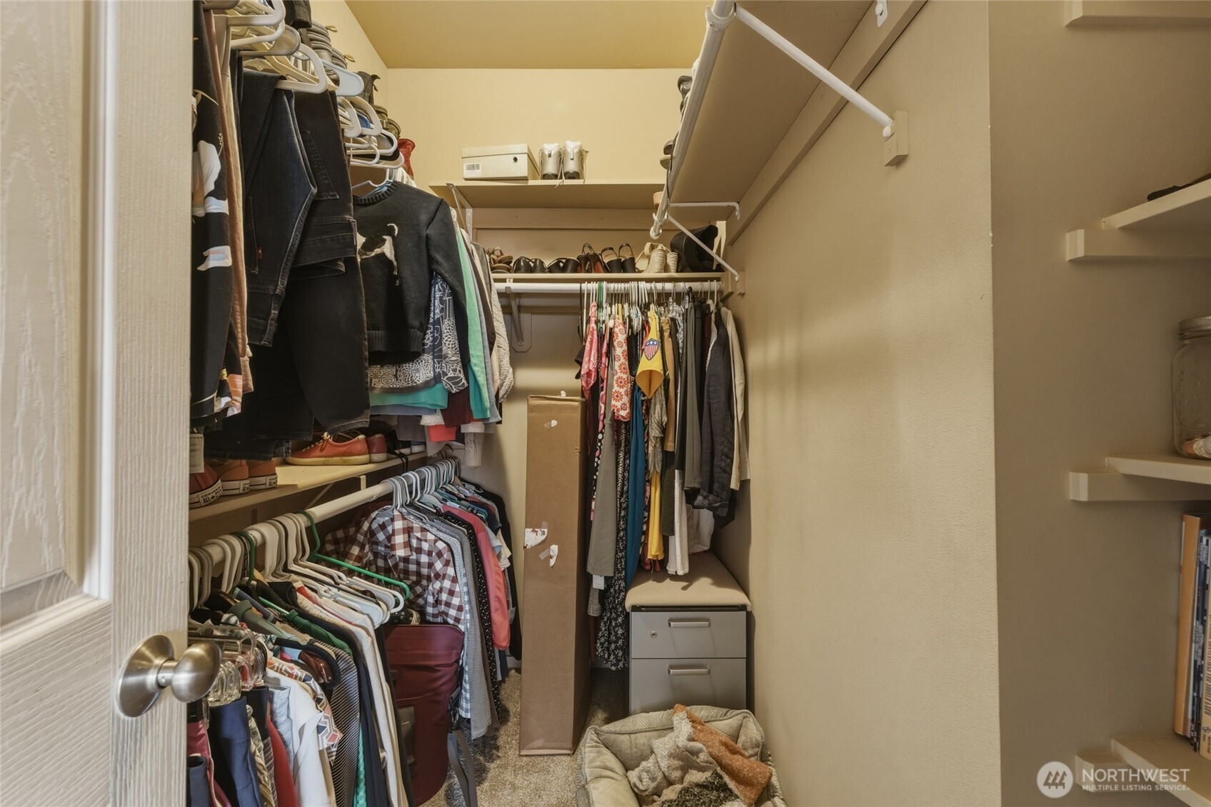 764 Southeast Quail Run College Place, WA 99324 - Photo 20 of 40 a view of walk in closet with clothes and shoes
