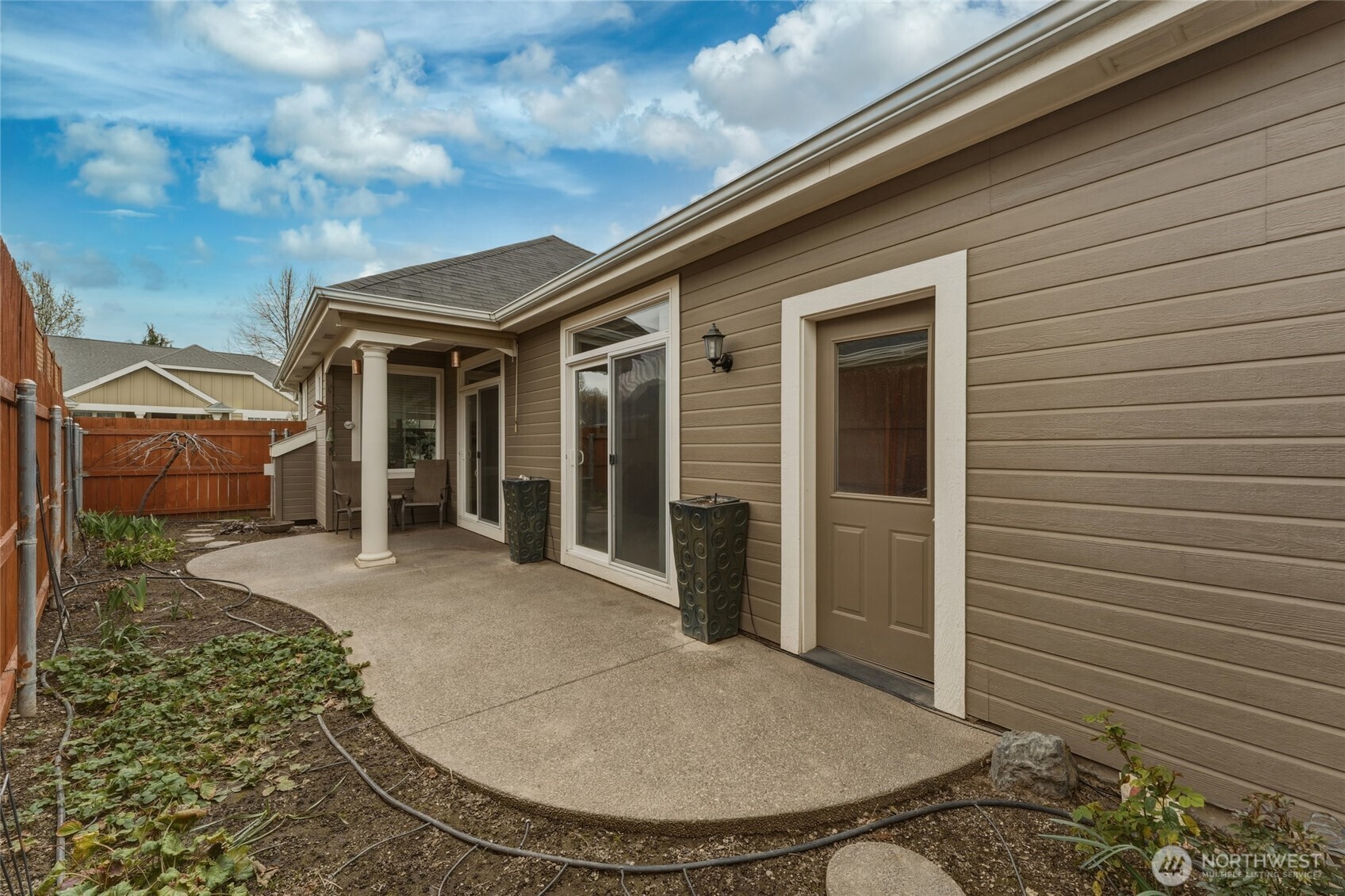 764 Southeast Quail Run College Place, WA 99324 - Photo 23 of 40 a view of a house with a backyard