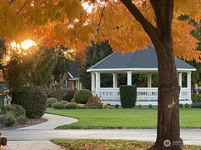 764 Southeast Quail Run College Place, WA 99324 - Photo 37 of 40 a front view of a house with a garden