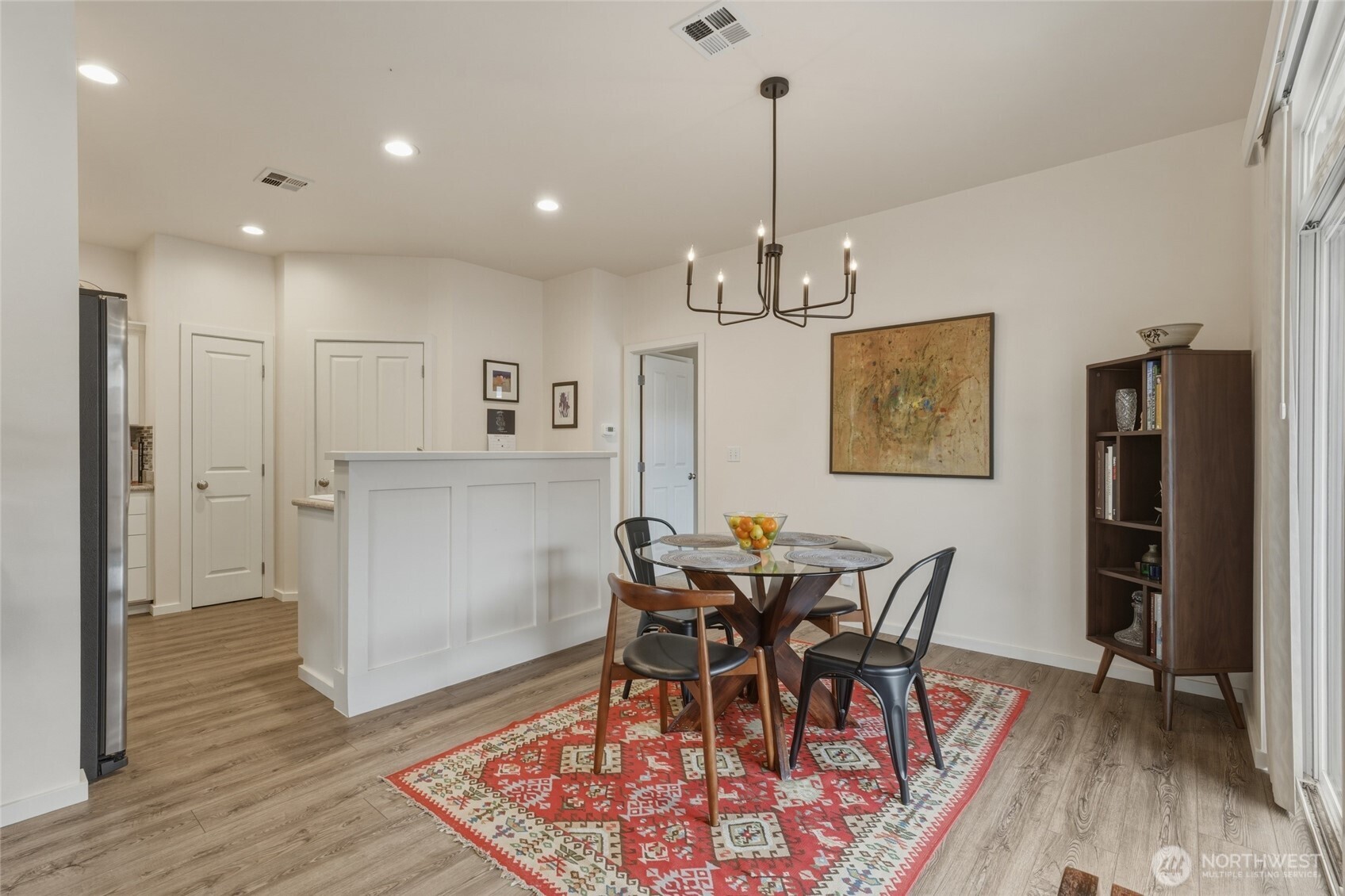 764 Southeast Quail Run College Place, WA 99324 - Photo 8 of 40 a view of a dining room with furniture and wooden floor
