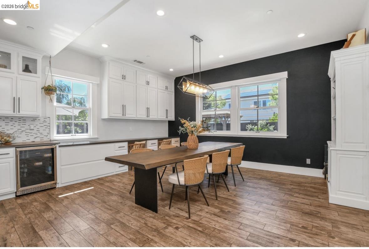 1605 Lone Oak Road Brentwood, CA 94513 - Photo 12 of 55 a kitchen with stainless steel appliances granite countertop a stove a sink a refrigerator a stove a dining table and chairs with wooden floor