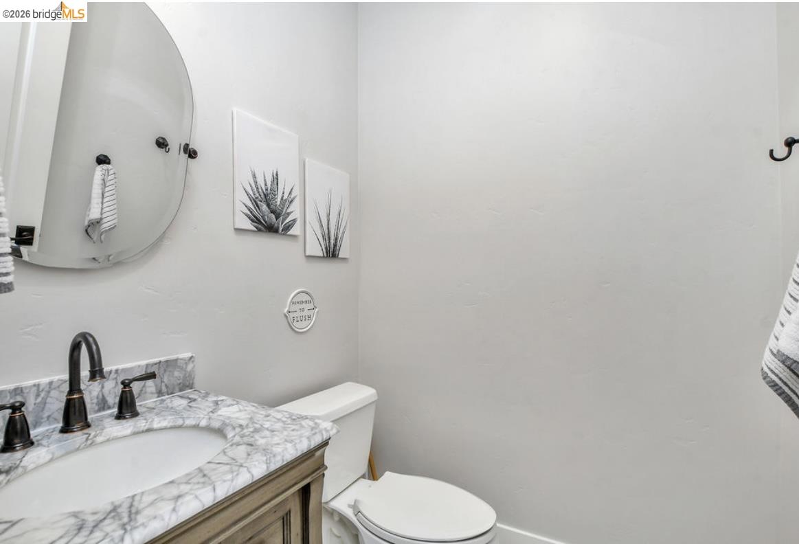 1605 Lone Oak Road Brentwood, CA 94513 - Photo 17 of 55 a bathroom with a granite countertop sink mirror vanity and toilet