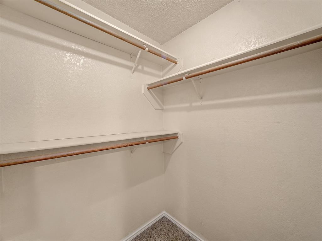121 Northeast Brushy Mound Road Burleson, TX 76028 - Photo 27 of 35 a view of a room with racks on the wall