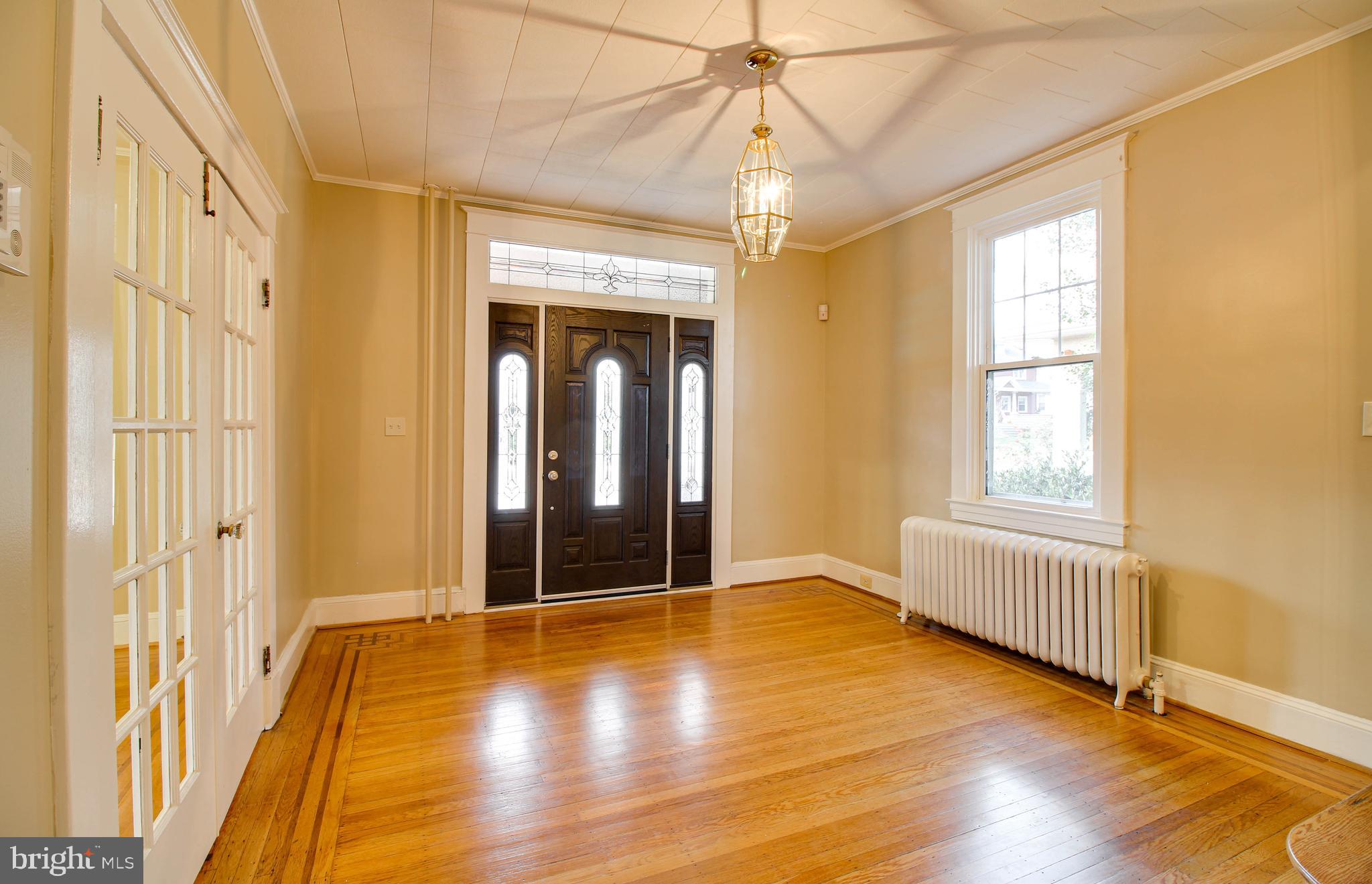 211 Mallow Hill Road Baltimore, MD 21229 - Photo 5 of 49 wooden floor in an empty room with a window