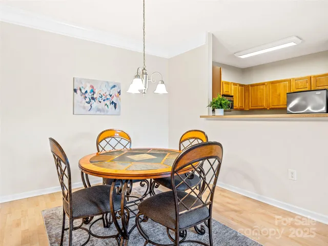 a view of a dining room furniture and chandelier