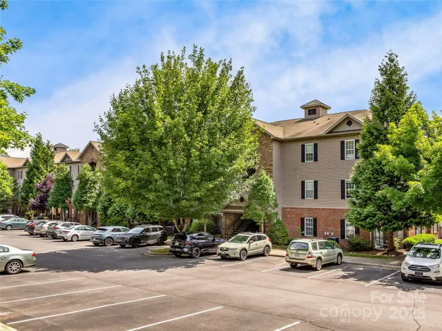 a view of a cars parked in front of a building