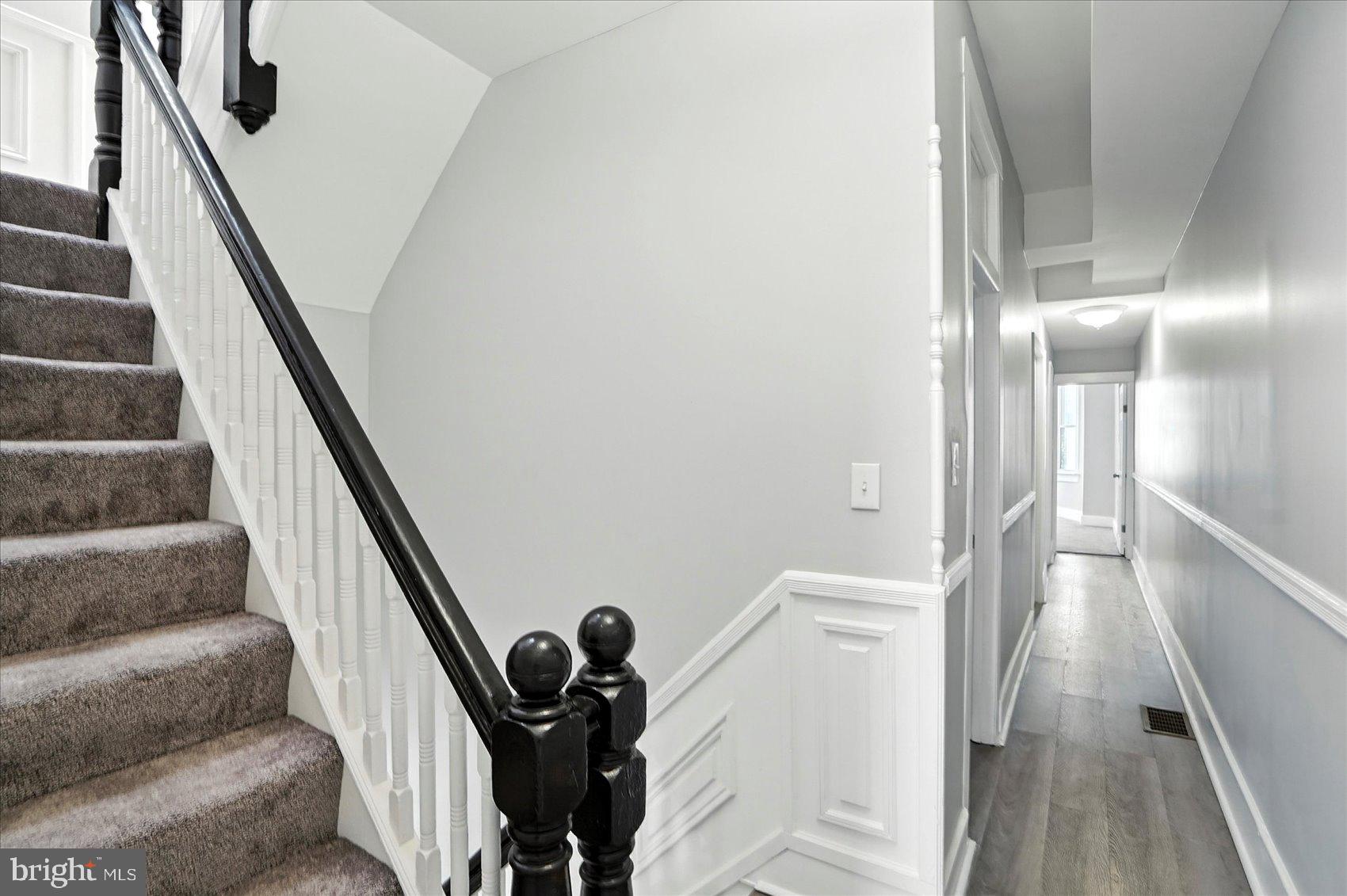 1628 East Biddle Street Baltimore, MD 21213 - Photo 14 of 35 a view of entryway and hall with wooden floor