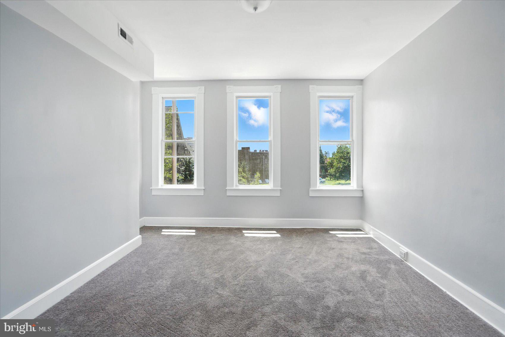 1628 East Biddle Street Baltimore, MD 21213 - Photo 15 of 35 an empty room with windows