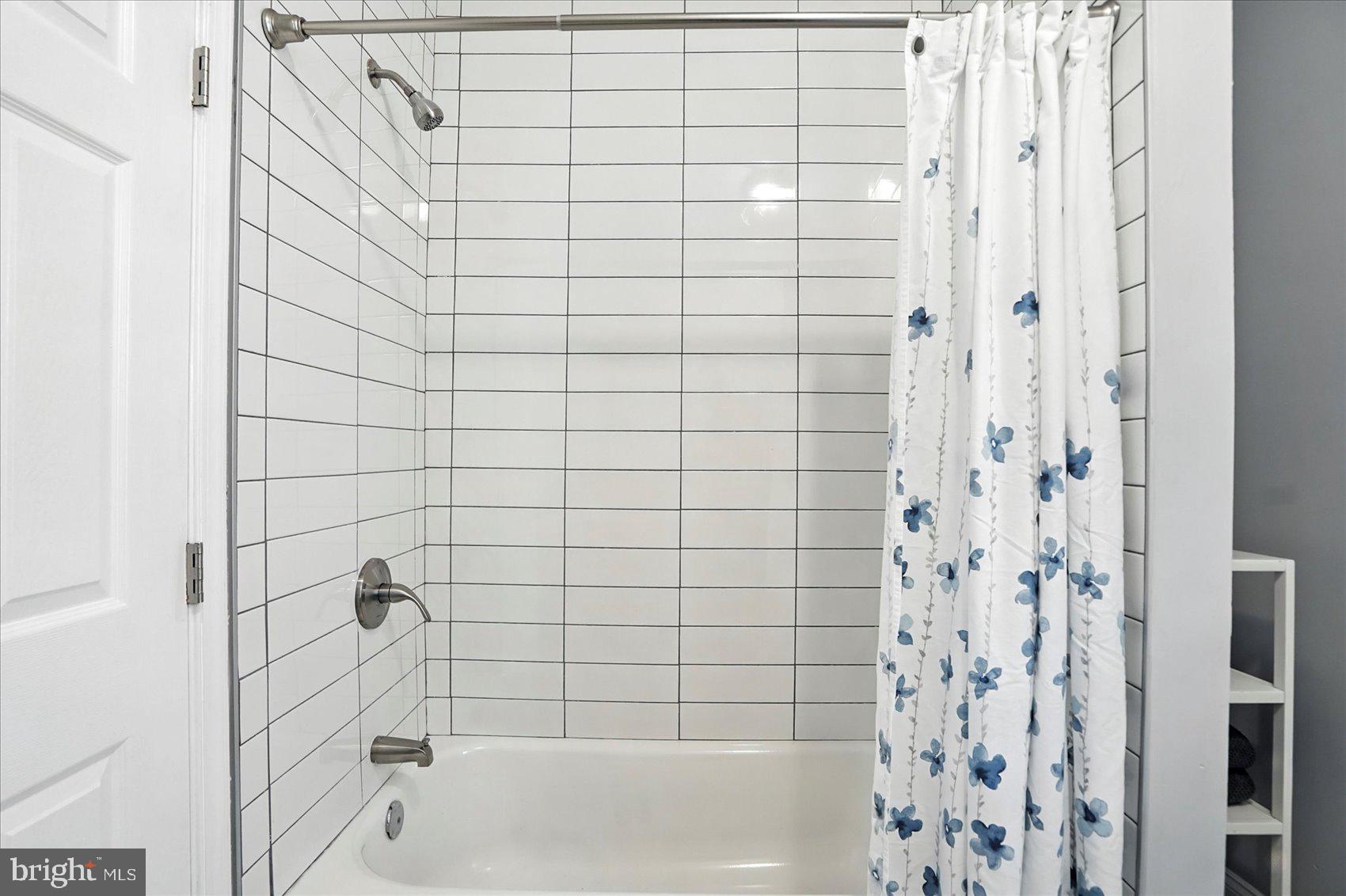 1628 East Biddle Street Baltimore, MD 21213 - Photo 20 of 35 a bathroom with a bathtub and shower