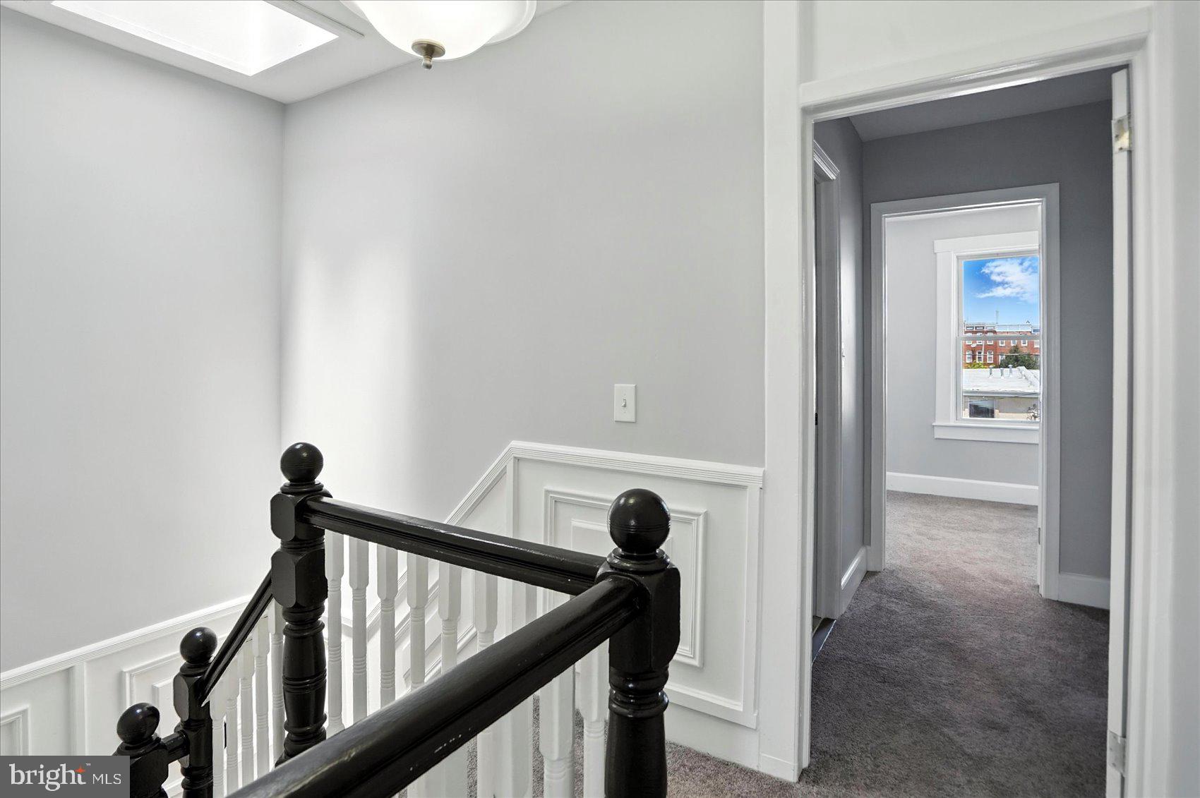 1628 East Biddle Street Baltimore, MD 21213 - Photo 24 of 35 a view of a staircase and a floor to ceiling window