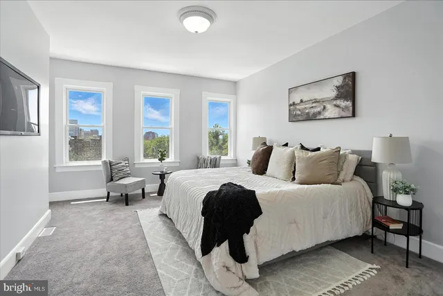 a bed room with a bed and a couch