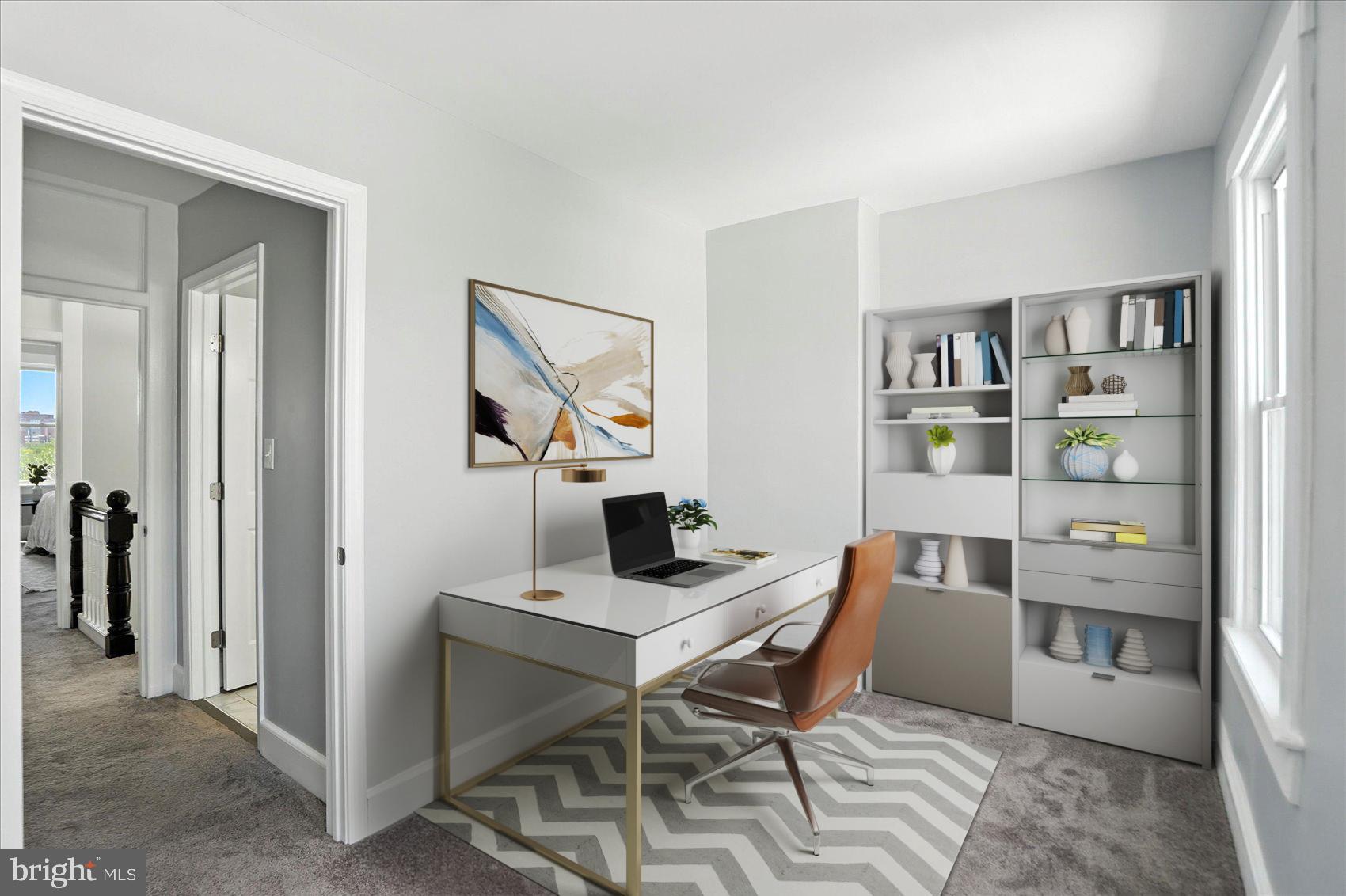 1628 East Biddle Street Baltimore, MD 21213 - Photo 32 of 35 a view of a workspace with furniture and closet