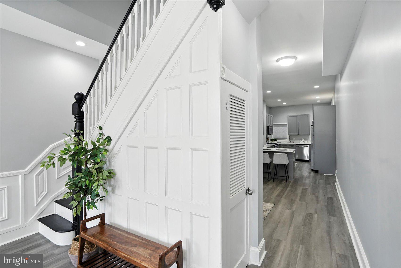 1628 East Biddle Street Baltimore, MD 21213 - Photo 5 of 35 a living room with furniture and a potted plant