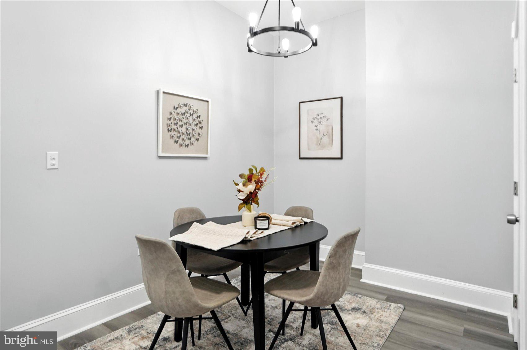 1628 East Biddle Street Baltimore, MD 21213 - Photo 6 of 35 a view of a dining room with furniture and wooden floor