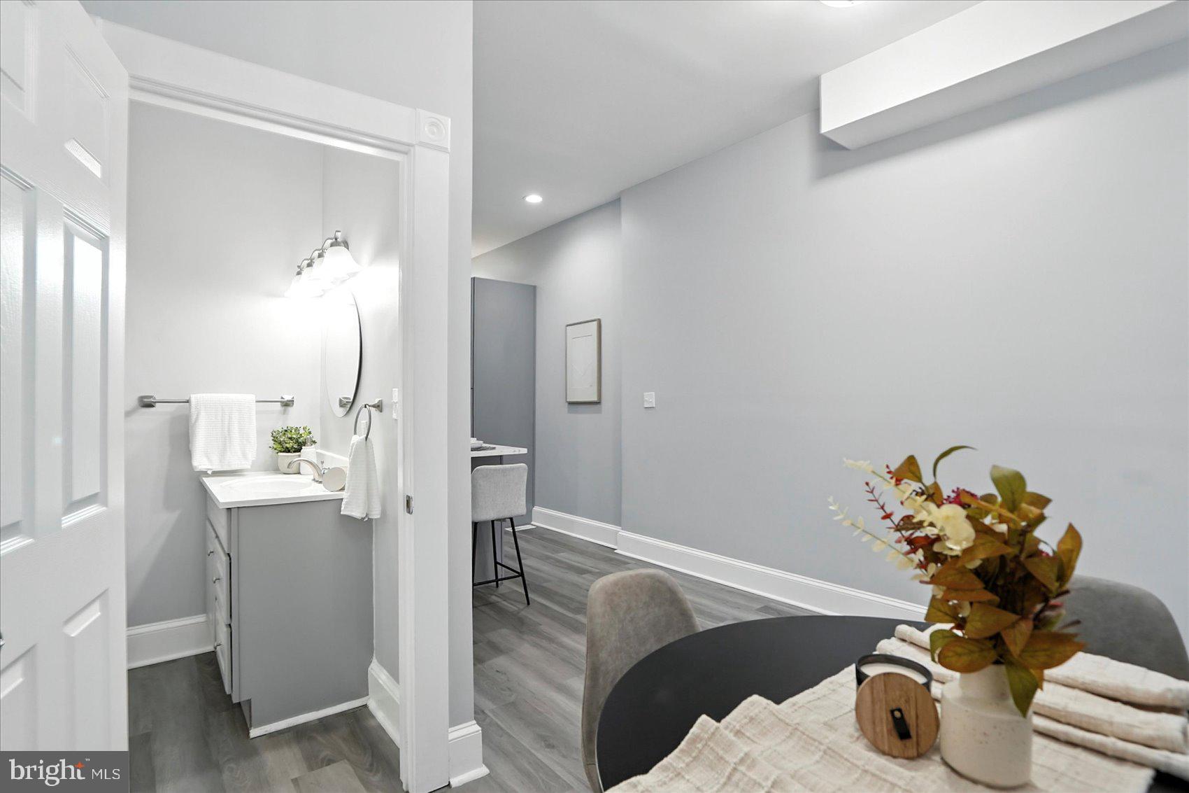 1628 East Biddle Street Baltimore, MD 21213 - Photo 7 of 35 a living room with furniture and a chandelier