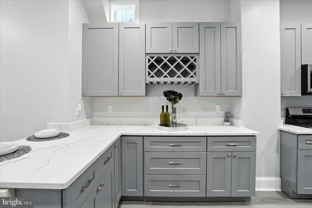 a kitchen with a sink cabinets and window