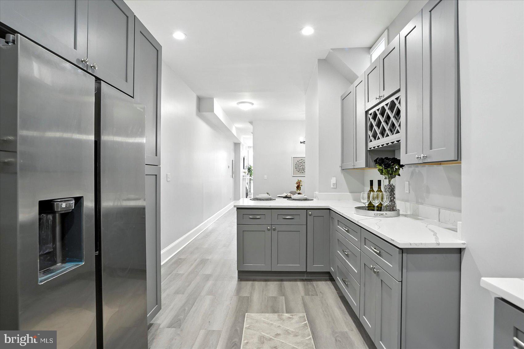 1628 East Biddle Street Baltimore, MD 21213 - Photo 10 of 35 a large bathroom with a double vanity sink and a mirror