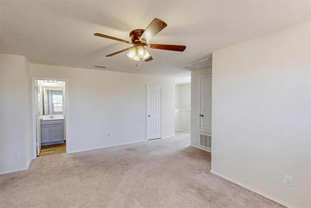 1103 Brazoria Road Forney, TX 75126 - Photo 12 of 25 a view of an empty room and window ceiling fan