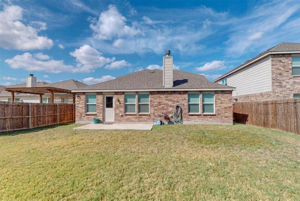 1103 Brazoria Road Forney, TX 75126 - Photo 24 of 25 a view of a house with backyard porch and sitting area