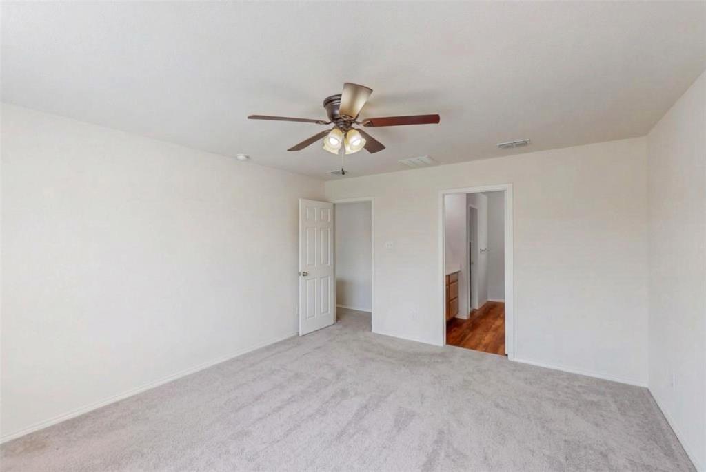 1103 Brazoria Road Forney, TX 75126 - Photo 8 of 25 a view of a room with a ceiling fan and a chandelier fan