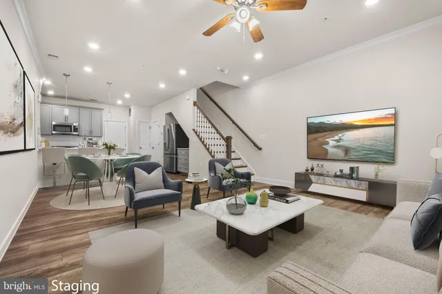 a front view of a residential apartment building with a yard