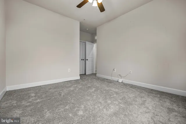 a view of a lake with houses in the back