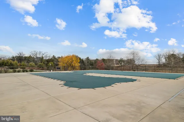 a view of a patio with a table and chairs