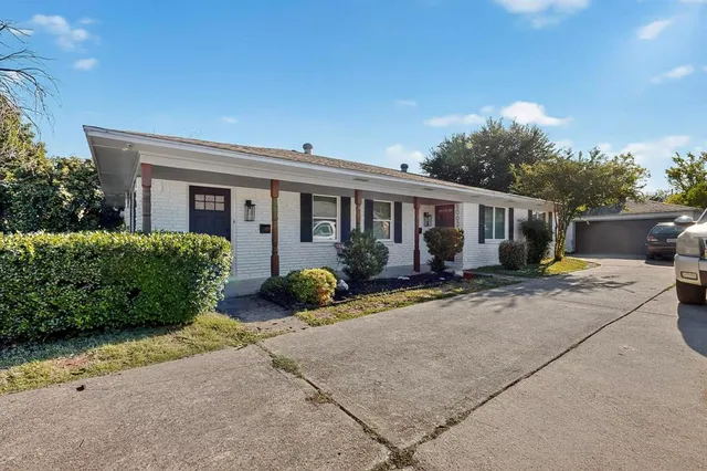 front view of a house with a patio
