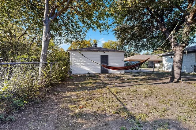 a house with trees in the background