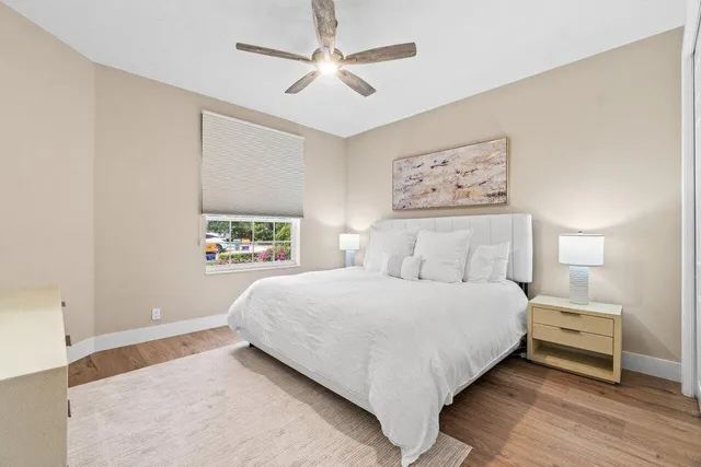 a bathroom with a sink toilet double vanity and shower
