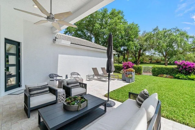 a front view of a house with porch and garden