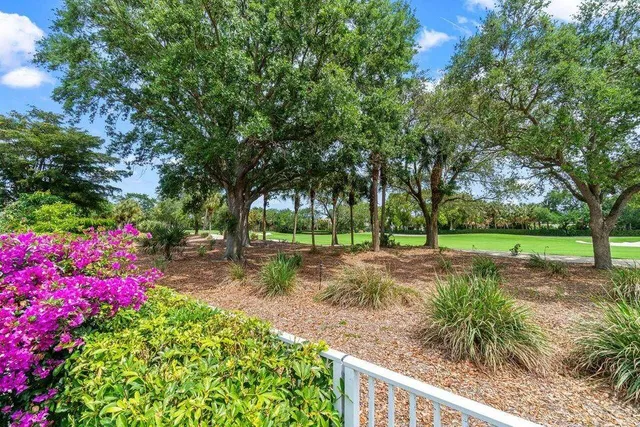 a view of a golf course with a big yard