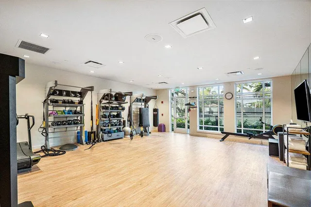 a bed room with a bed and a television