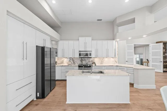 a dining room with furniture and wooden floor