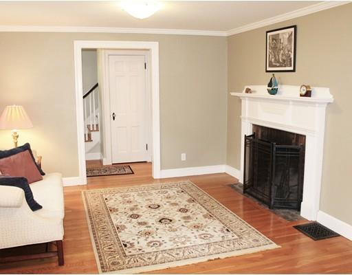 79 Robbins Road Lexington, MA 02421 - Photo 5 of 17 a bedroom with a bed and a fireplace