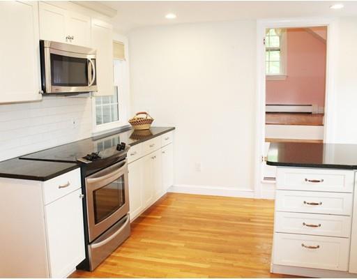 79 Robbins Road Lexington, MA 02421 - Photo 9 of 17 a kitchen with a stove and a microwave