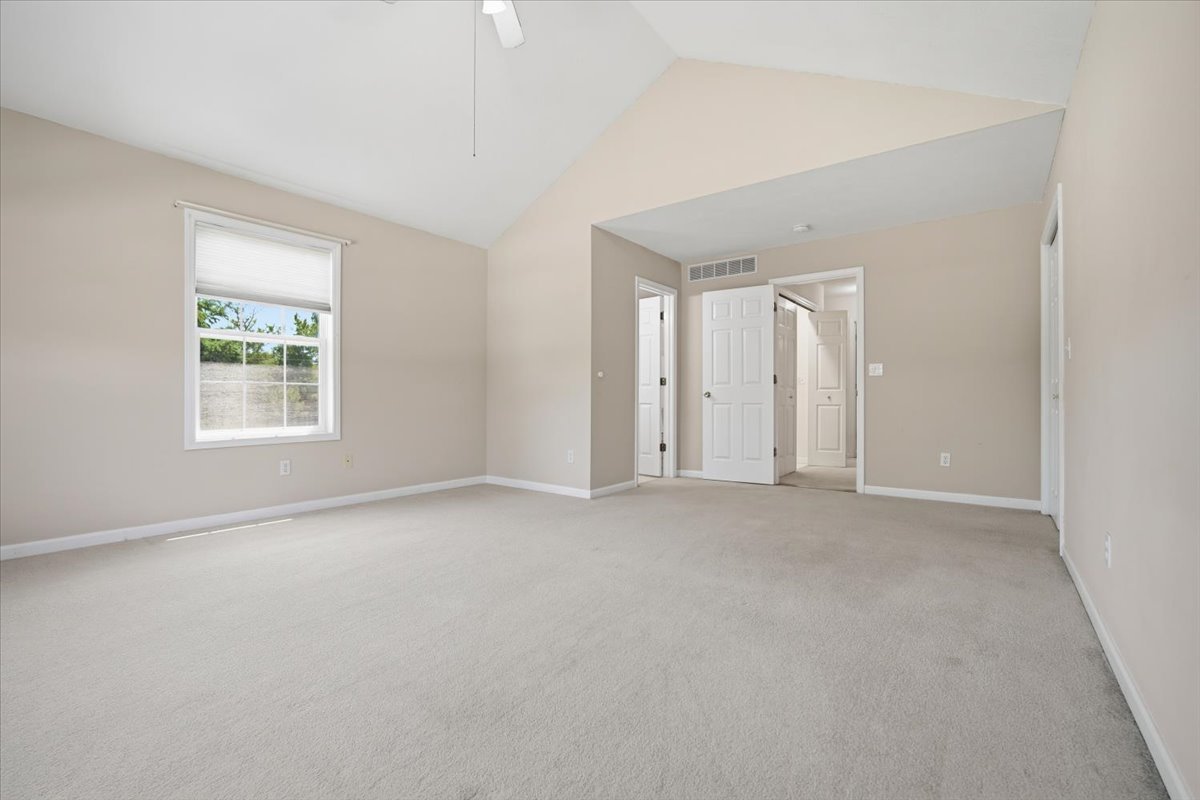 311 Old Farm Road Bloomington, IL 61704 - Photo 18 of 34 an empty room with windows and closet